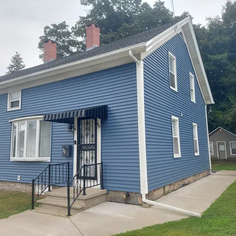 a front view of a house with a garage