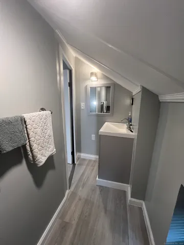 a view of front door with a bench