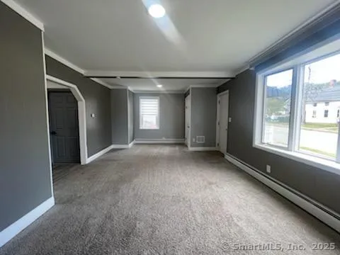 a view of an empty room with a window