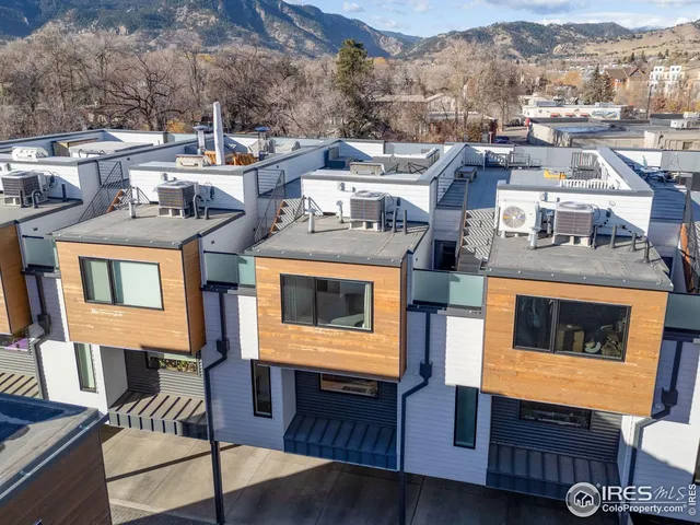 a view of a terrace with couches and lounge chairs