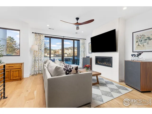 a bedroom with furniture and large windows