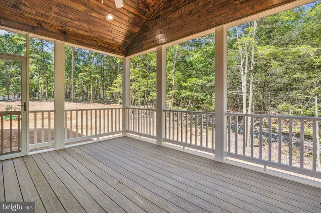 a view of outdoor space with wooden floor and city view