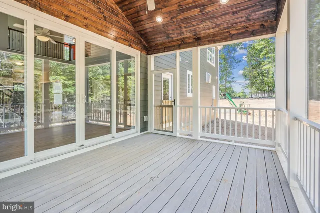 a view of outdoor space with wooden floor and city view
