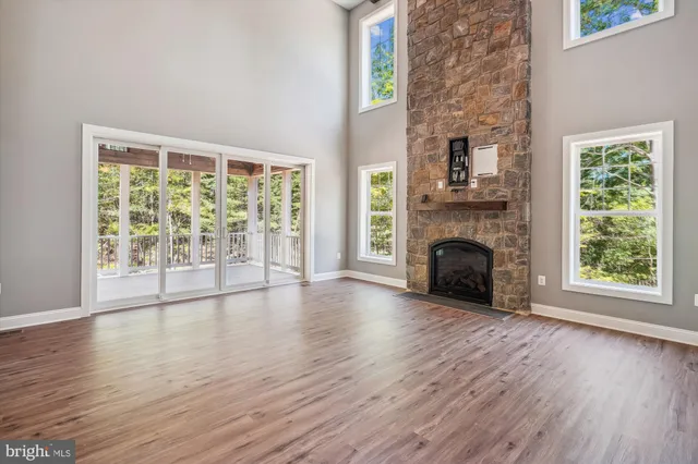 a view of a kitchen with wooden floor and a kitchen