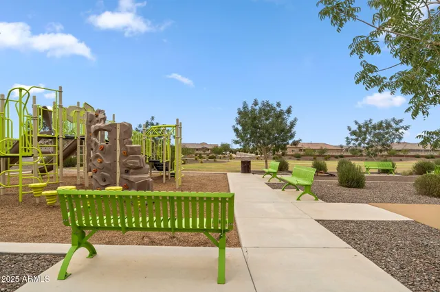 a view of swimming pool with outdoor seating and plants