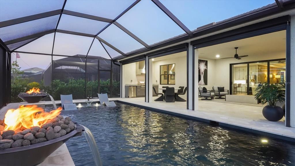 12866 Pinnacle Lane Venice, FL 34293 - Photo 12 of 96 a view of a swimming pool with sitting area