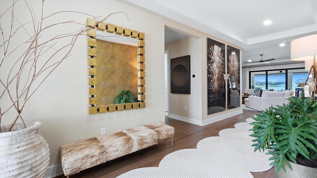 12866 Pinnacle Lane Venice, FL 34293 - Photo 22 of 96 a living room with furniture and a potted plant