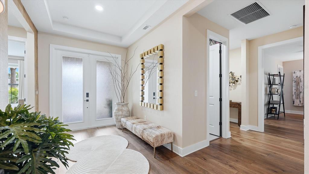 12866 Pinnacle Lane Venice, FL 34293 - Photo 23 of 96 a living room with furniture and a potted plant