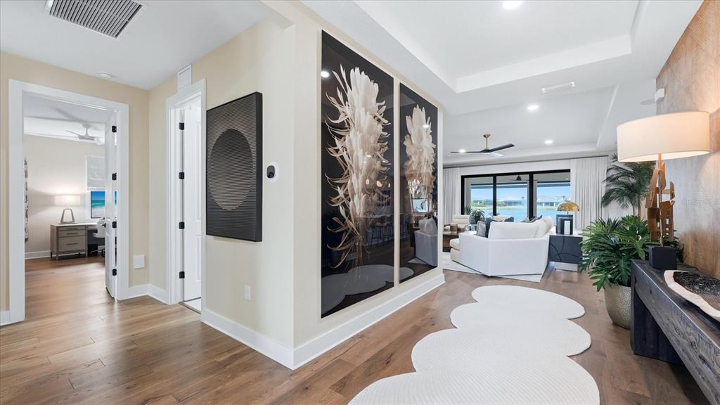 12866 Pinnacle Lane Venice, FL 34293 - Photo 24 of 96 a living room with furniture and a large window
