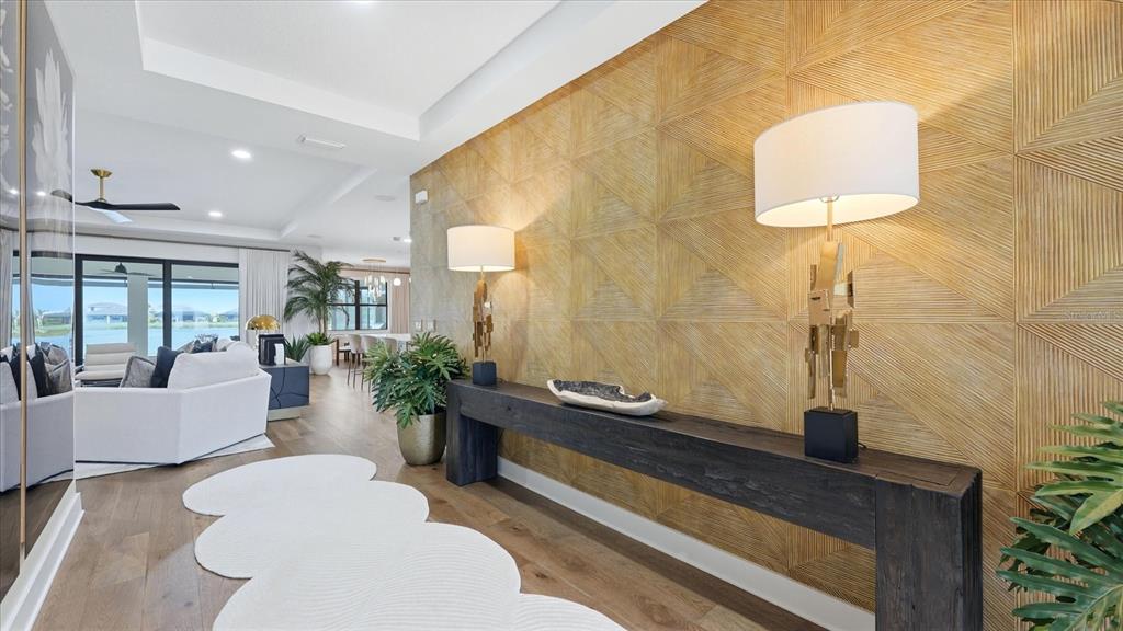 12866 Pinnacle Lane Venice, FL 34293 - Photo 26 of 96 a living room with furniture and a window