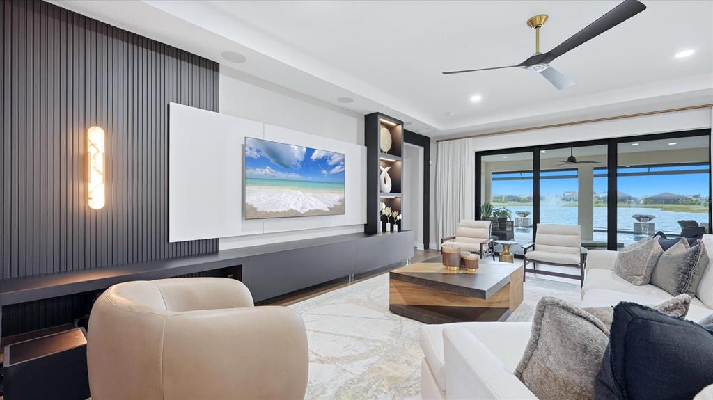 12866 Pinnacle Lane Venice, FL 34293 - Photo 27 of 96 a living room with furniture and a large window