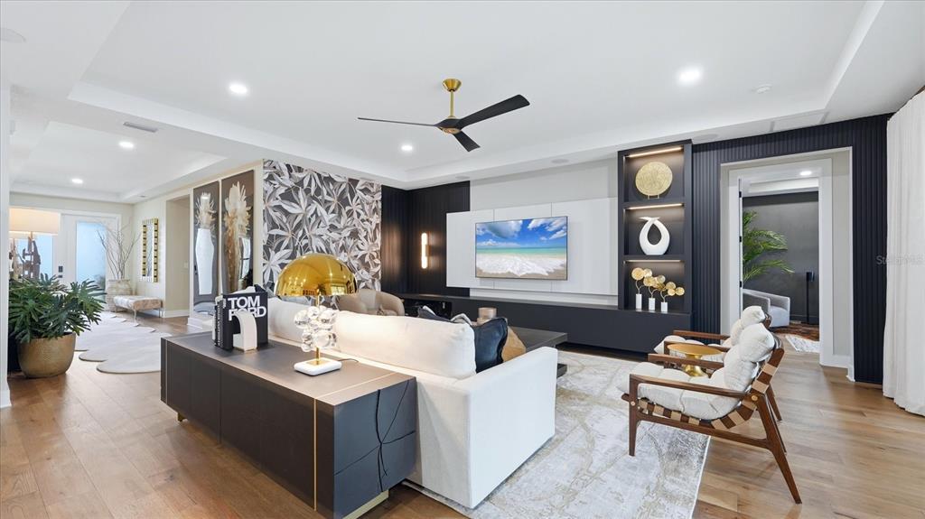 12866 Pinnacle Lane Venice, FL 34293 - Photo 30 of 96 a living room with furniture and a large window