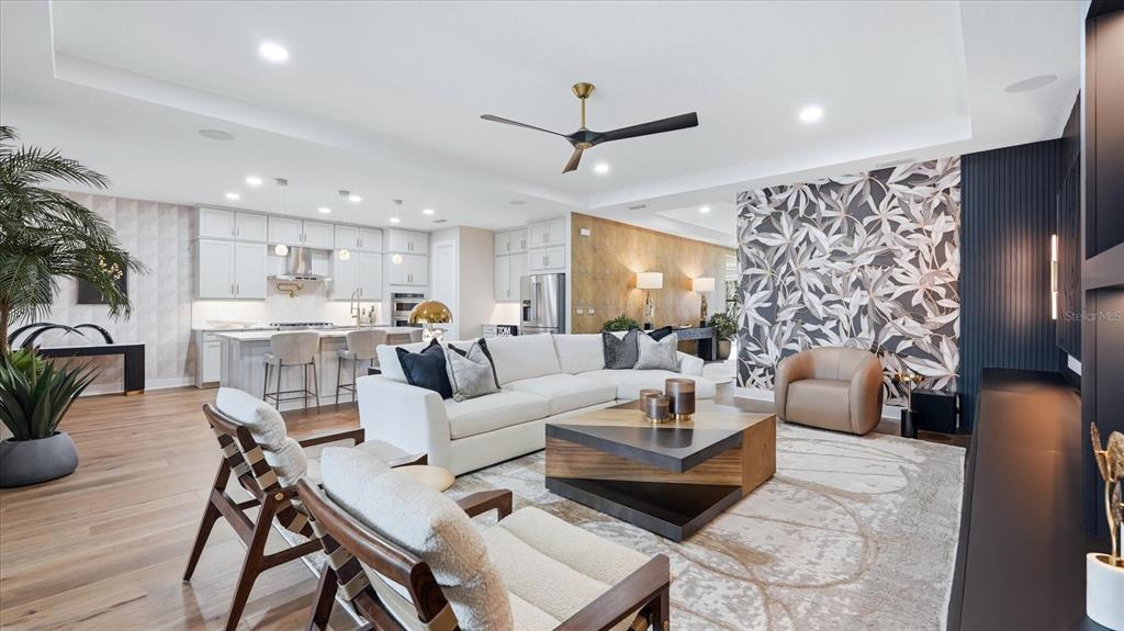 12866 Pinnacle Lane Venice, FL 34293 - Photo 31 of 96 a living room with furniture and a large window