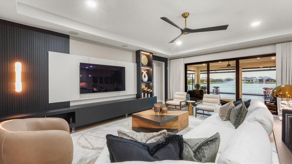 12866 Pinnacle Lane Venice, FL 34293 - Photo 34 of 96 a living room with furniture and a large window