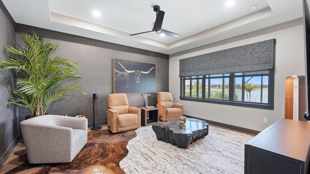 12866 Pinnacle Lane Venice, FL 34293 - Photo 35 of 96 a living room with furniture and a large window