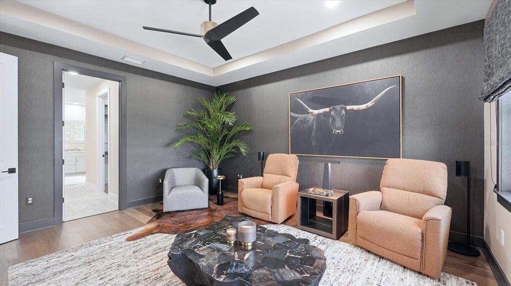 12866 Pinnacle Lane Venice, FL 34293 - Photo 36 of 96 a living room with furniture and a potted plant