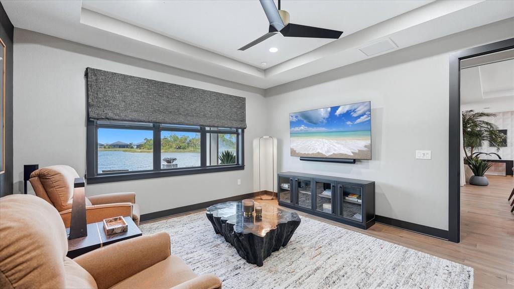 12866 Pinnacle Lane Venice, FL 34293 - Photo 37 of 96 a living room with furniture and a window