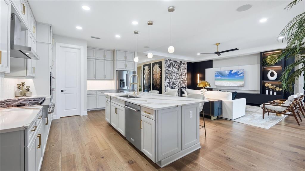 12866 Pinnacle Lane Venice, FL 34293 - Photo 40 of 96 a kitchen with stainless steel appliances granite countertop a stove and a refrigerator