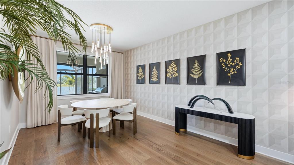 12866 Pinnacle Lane Venice, FL 34293 - Photo 46 of 96 a dining room with furniture and window