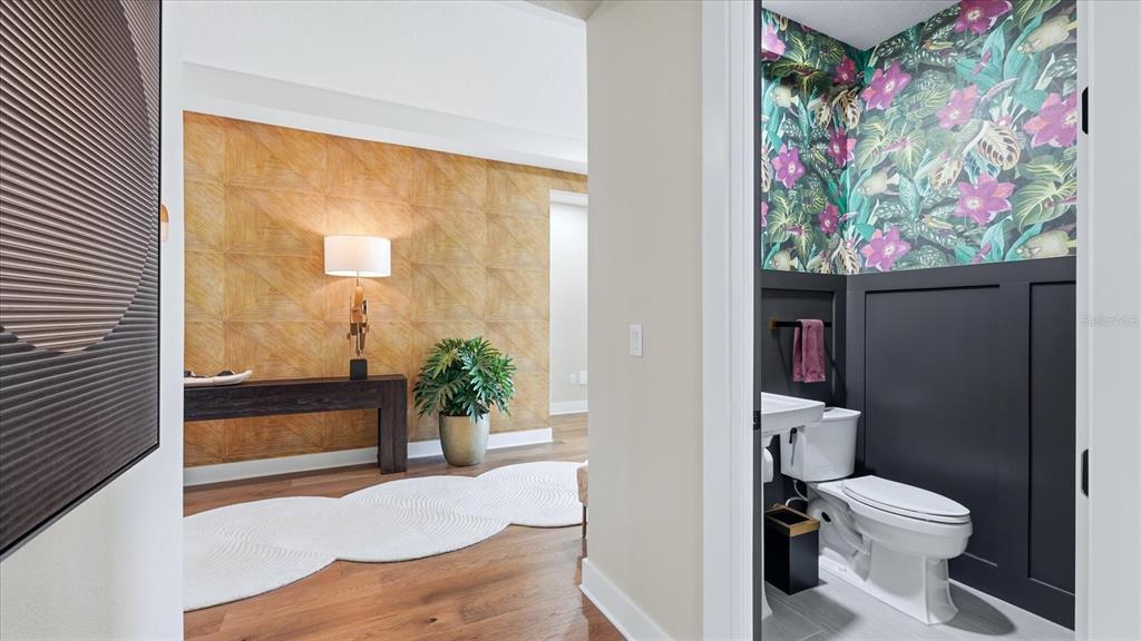 12866 Pinnacle Lane Venice, FL 34293 - Photo 48 of 96 a bathroom with a toilet and a shower curtain