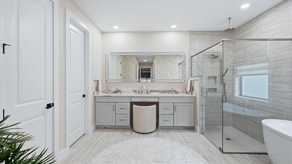 12866 Pinnacle Lane Venice, FL 34293 - Photo 59 of 96 a bathroom with a granite countertop sink a toilet and shower