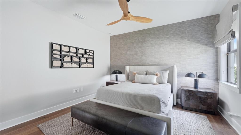 12866 Pinnacle Lane Venice, FL 34293 - Photo 62 of 96 a bedroom with a bed and a lamp