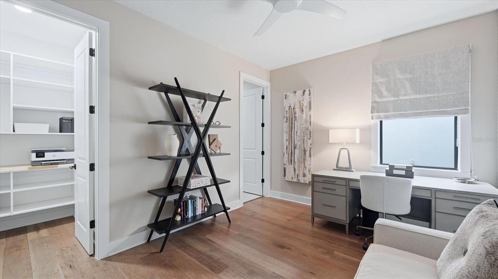 12866 Pinnacle Lane Venice, FL 34293 - Photo 65 of 96 a view of a livingroom with furniture and wooden floor