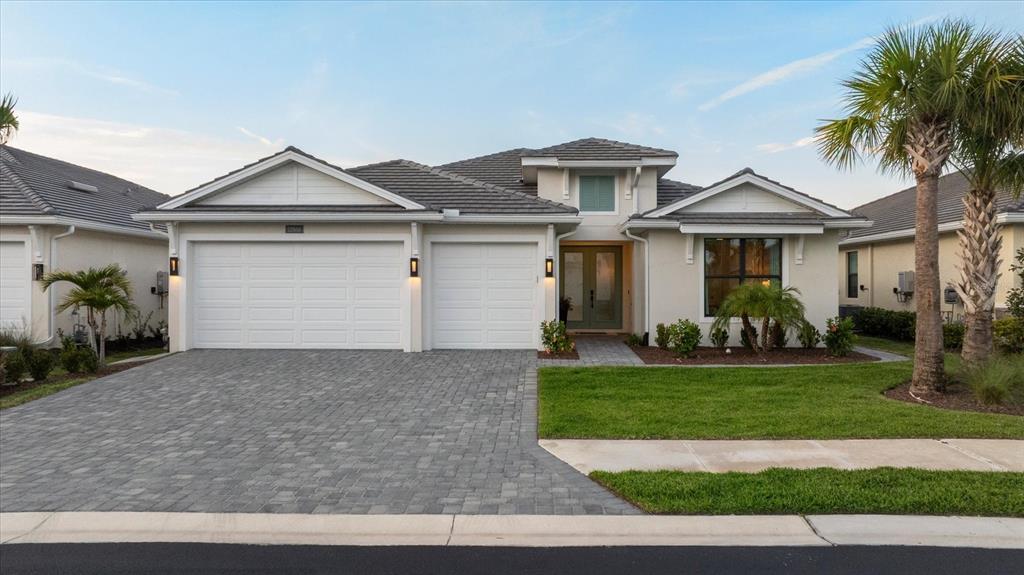 12866 Pinnacle Lane Venice, FL 34293 - Photo 71 of 96 a front view of a house with a yard