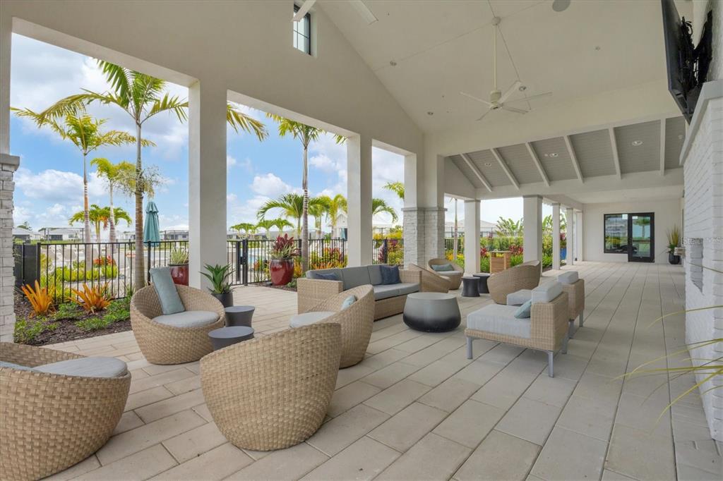 12866 Pinnacle Lane Venice, FL 34293 - Photo 79 of 96 a living room with furniture and large windows