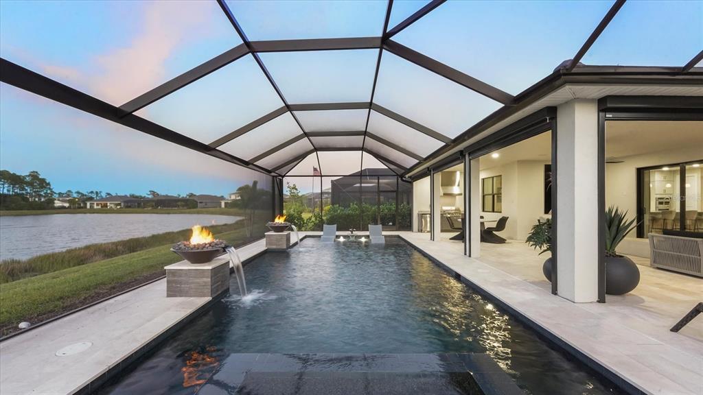 12866 Pinnacle Lane Venice, FL 34293 - Photo 8 of 96 a view of a swimming pool with outdoor seating and city view