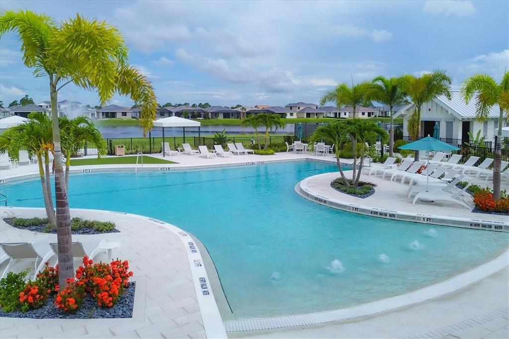 12866 Pinnacle Lane Venice, FL 34293 - Photo 81 of 96 a view of a swimming pool with a table and chairs