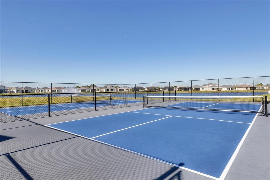 12866 Pinnacle Lane Venice, FL 34293 - Photo 87 of 96 a view of an outdoor space and tennis court