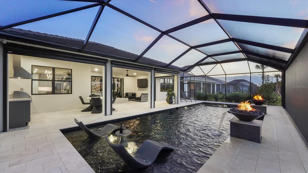 12866 Pinnacle Lane Venice, FL 34293 - Photo 10 of 96 a living room with furniture and a window