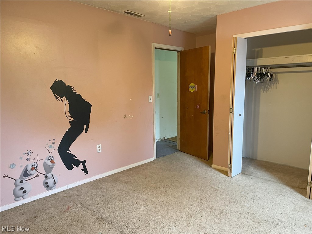 4107 Jaeger Road Lorain, OH 44053 - Photo 17 of 33 Unfurnished bedroom with light colored carpet and a closet