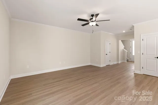 a view of kitchen with cabinets and wooden floor