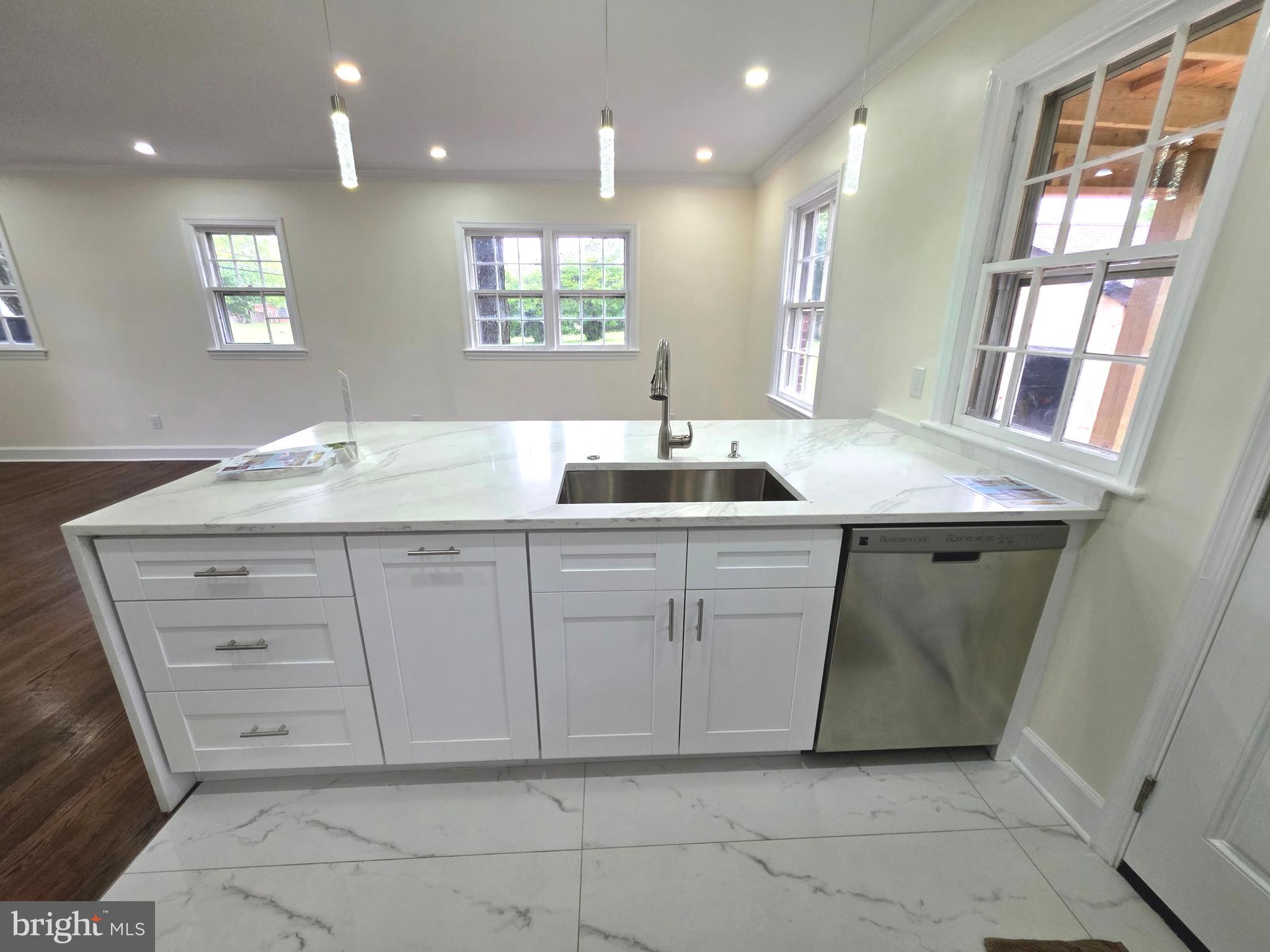 2206 Brinkley Road Fort Washington, MD 20744 - Photo 47 of 78 a bathroom with a granite countertop sink a mirror and a