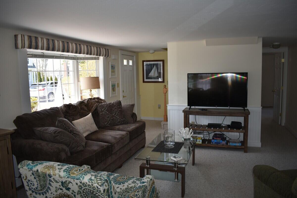 28 Santucket Road West Dennis, MA 02670 - Photo 5 of 23 a living room with furniture and a flat screen tv