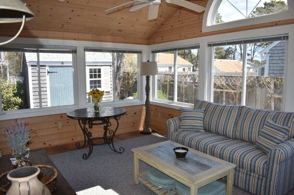 28 Santucket Road West Dennis, MA 02670 - Photo 7 of 23 a living room with furniture and a large window