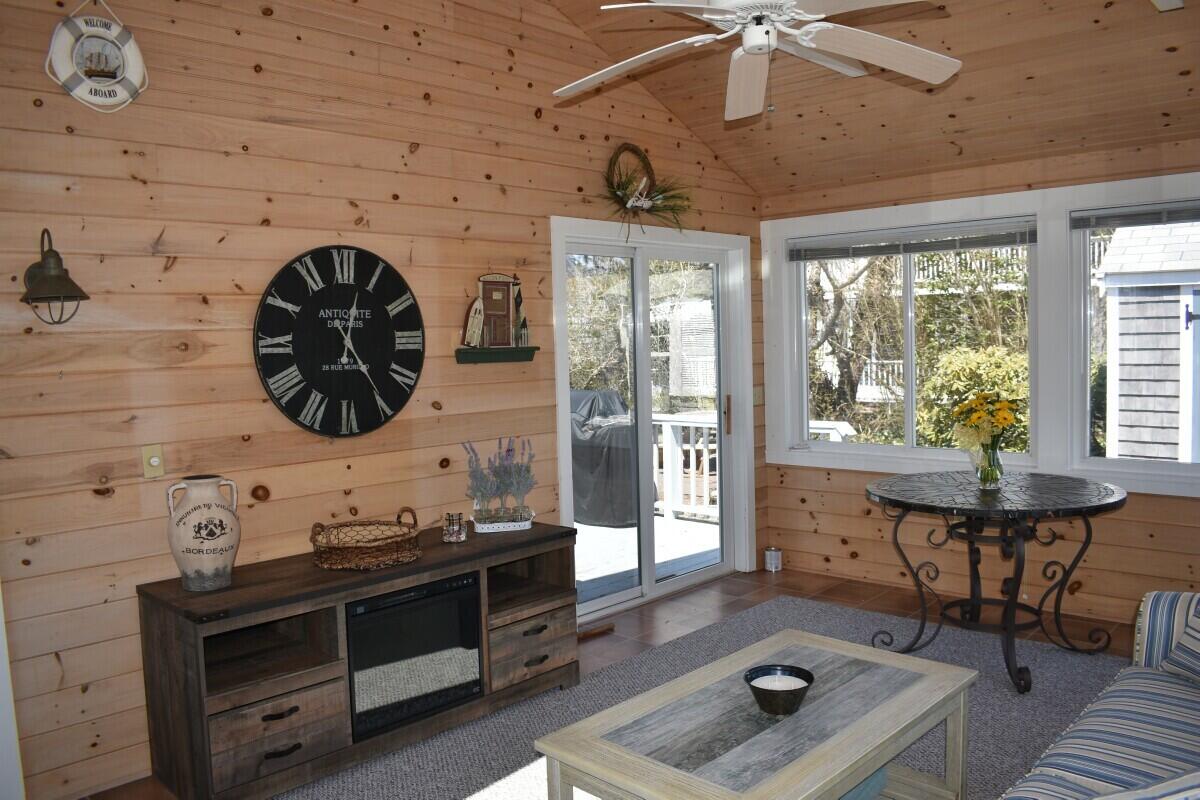 28 Santucket Road West Dennis, MA 02670 - Photo 8 of 23 a living room with a couch and a table