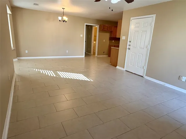 a view of a hallway with wooden shelves