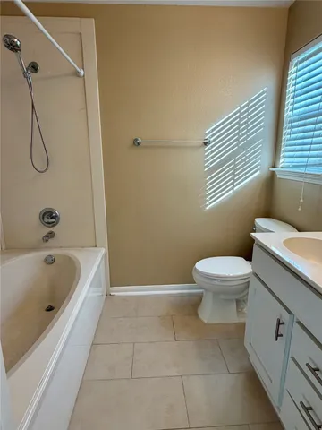 a bathroom with a toilet and a bathtub