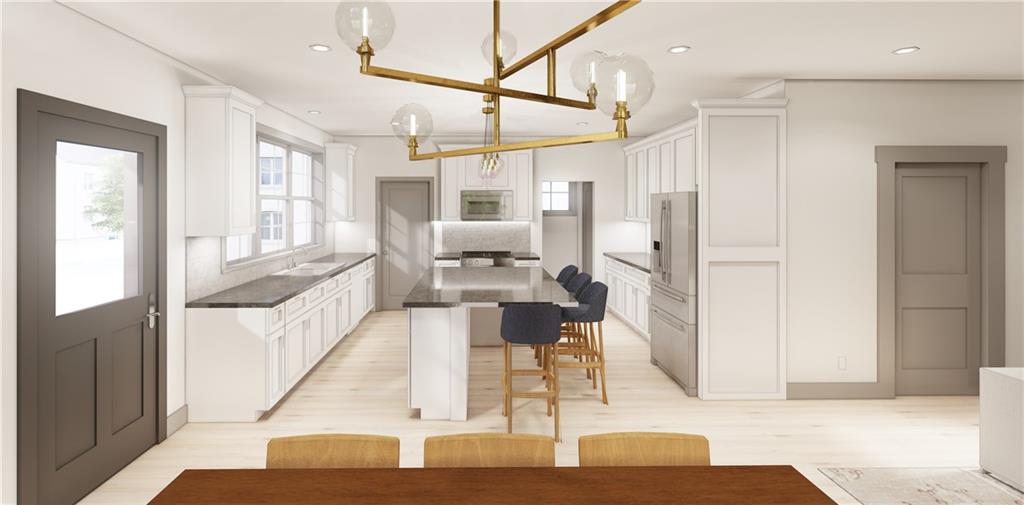 558 Mifflin Avenue Pittsburgh, PA 15221 - Photo 3 of 6 a living room with stainless steel appliances kitchen island granite countertop furniture and a fireplace