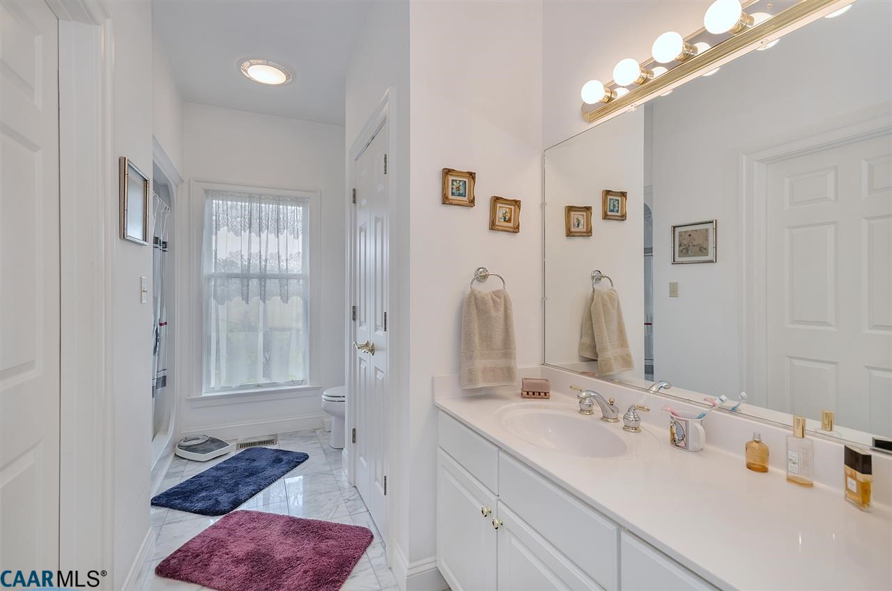 3895 Jacks Shop Road Rochelle, VA 22738 - Photo 16 of 41 a en suite bathroom with double vanity and a mirror