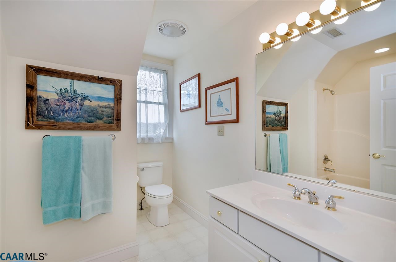 3895 Jacks Shop Road Rochelle, VA 22738 - Photo 19 of 41 a bathroom with a toilet a sink and mirror
