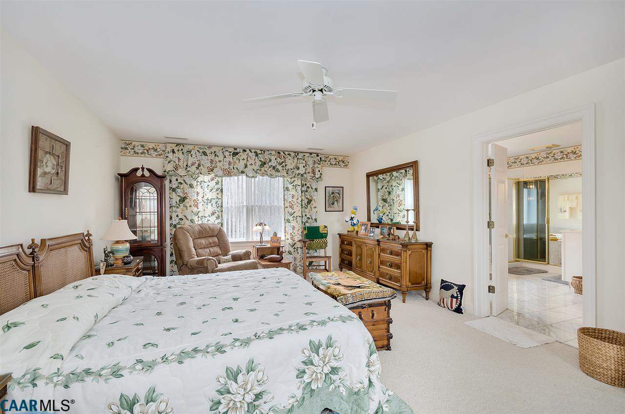 3895 Jacks Shop Road Rochelle, VA 22738 - Photo 20 of 41 a bedroom with a large bed and wooden floor