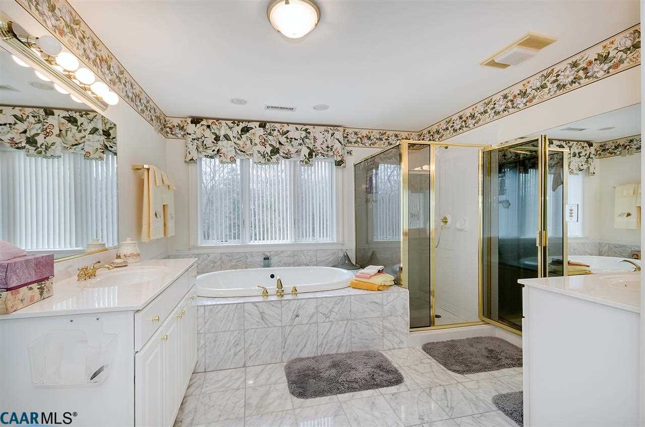 3895 Jacks Shop Road Rochelle, VA 22738 - Photo 21 of 41 a bathroom with a tub a sink a mirror and a shower