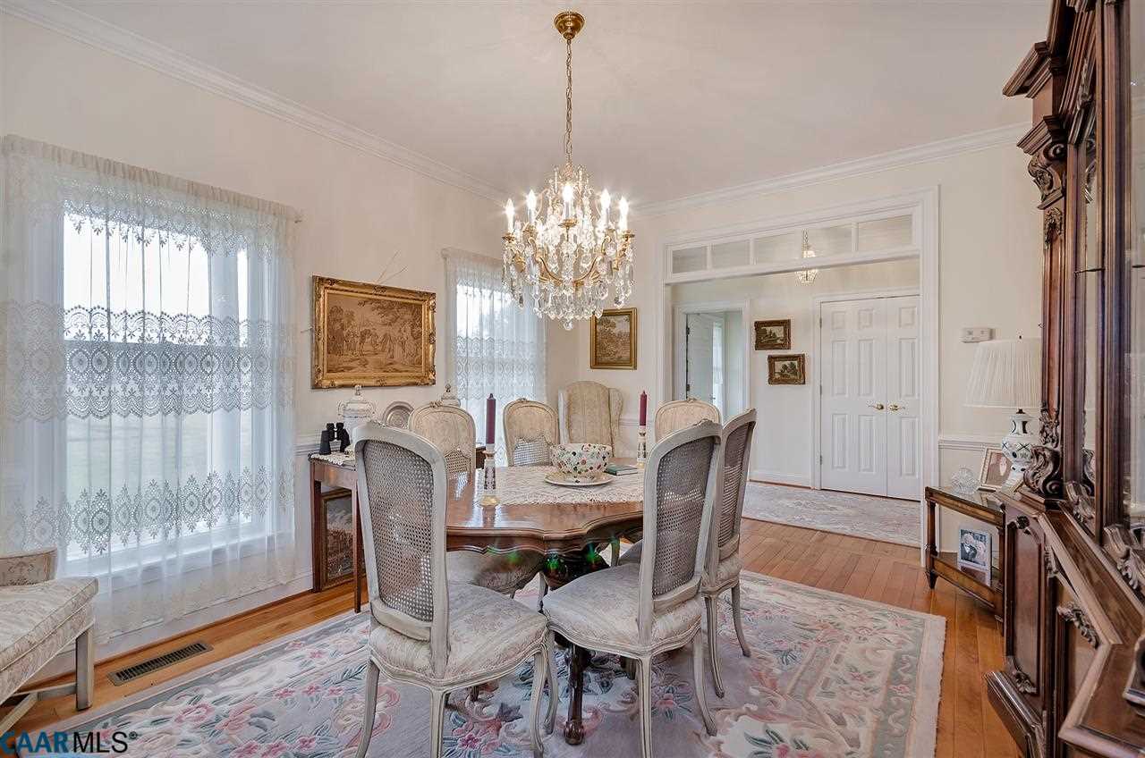 3895 Jacks Shop Road Rochelle, VA 22738 - Photo 8 of 41 a dining room with furniture a chandelier and wooden floor