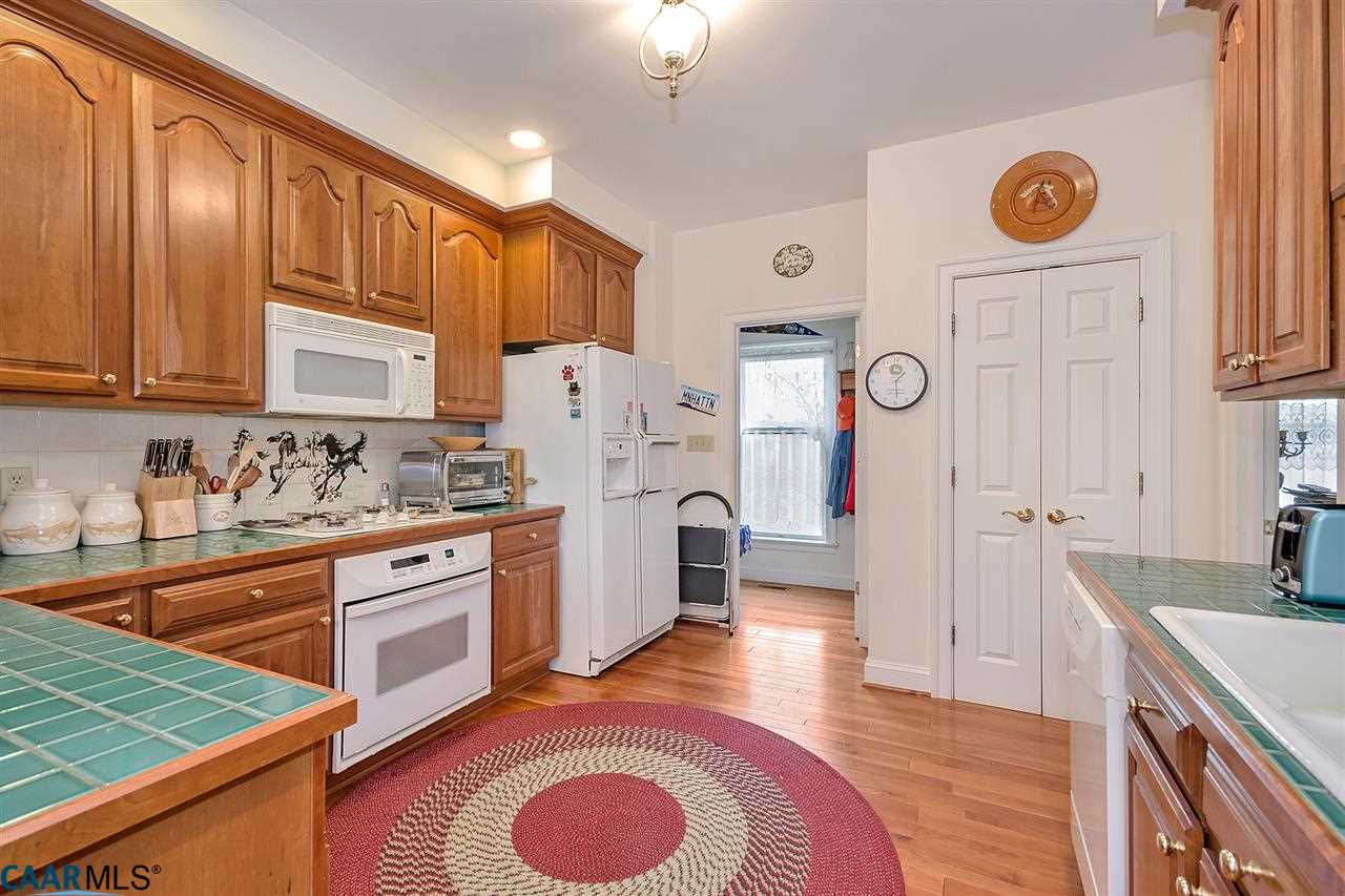 3895 Jacks Shop Road Rochelle, VA 22738 - Photo 10 of 41 a large kitchen with stainless steel appliances granite countertop a sink stove and refrigerator