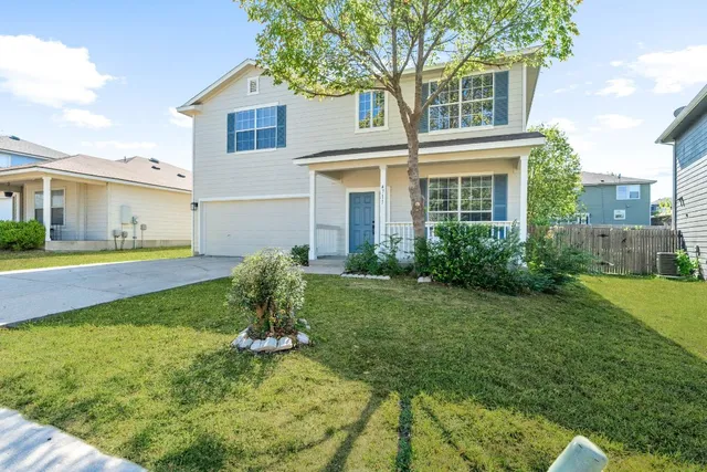 a house view with a garden space