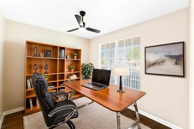 a work room with furniture and windows